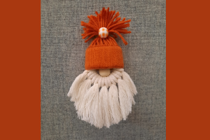 Gnome made from white and orange yarn