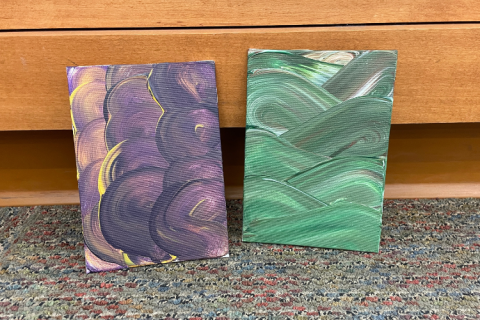 Two canvasses with wide, multi-tone swirls