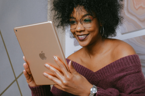 Woman looking at an Apple iPad