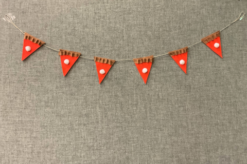 A line of cloth bunting made with orange triangles