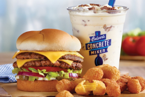 Photo of double cheeseburger, cheese curds, and shake