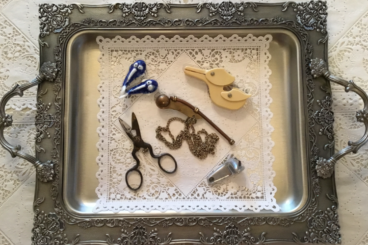 5 antique items on a tray