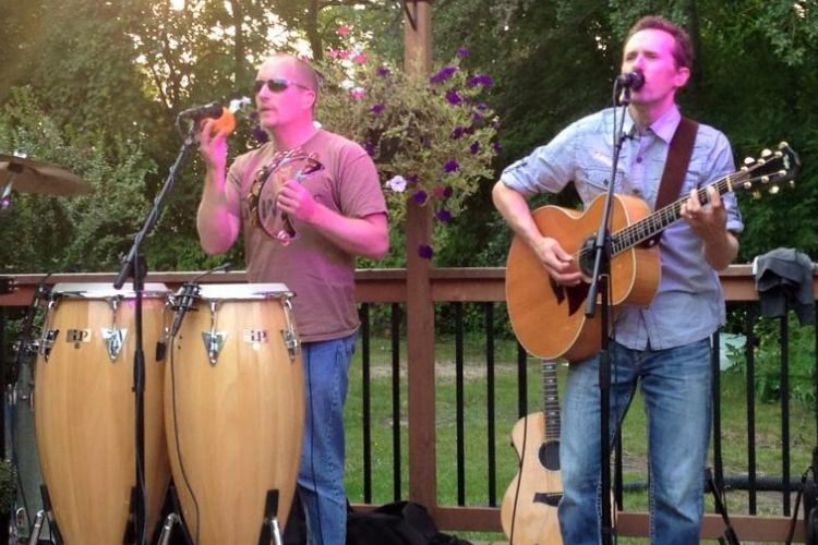 Two musicians playing a song outside