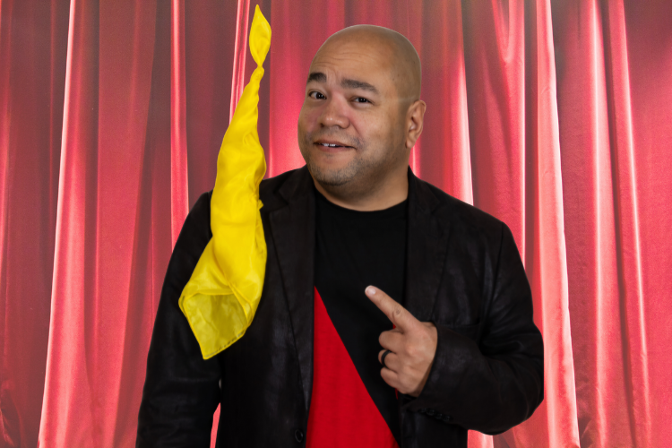 Magician pointing to a floating handkerchief