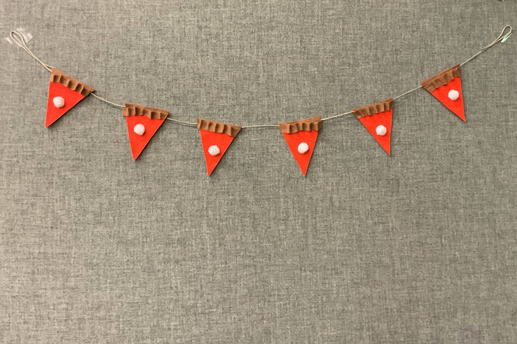 A line of cloth bunting made with orange triangles